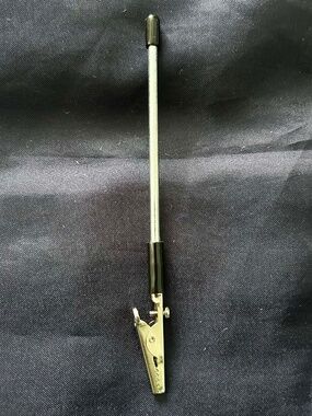 BRACELET AID, HOLDS BRACELET WHILE YOU PUT IT ON, PRACTICAL, USEFUL, METAL AND